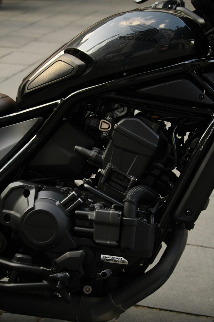 Detailed view of a sleek Honda motorcycle engine showing chrome and design.